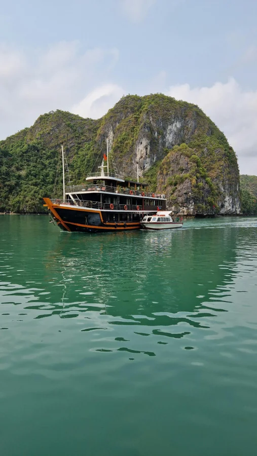 Vietnam Ha Long Bay with limestone karsts rising from emerald water